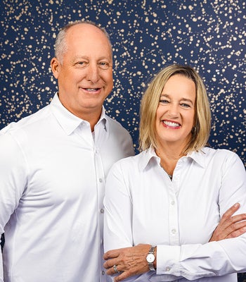 Portrait of Leslie + Chris Mease, Realtor/ Broker Associate.